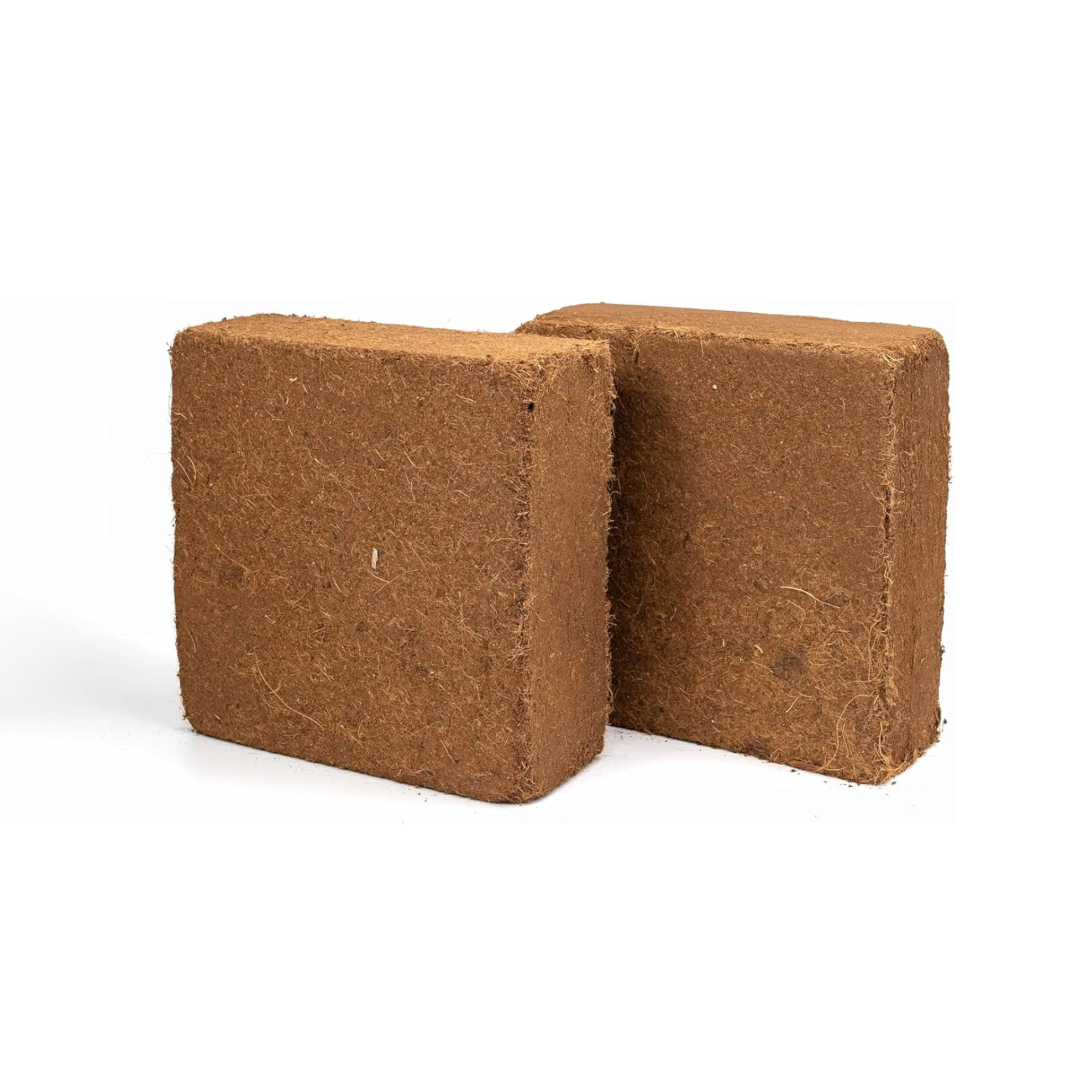 Two brown coco peat bricks on a white background